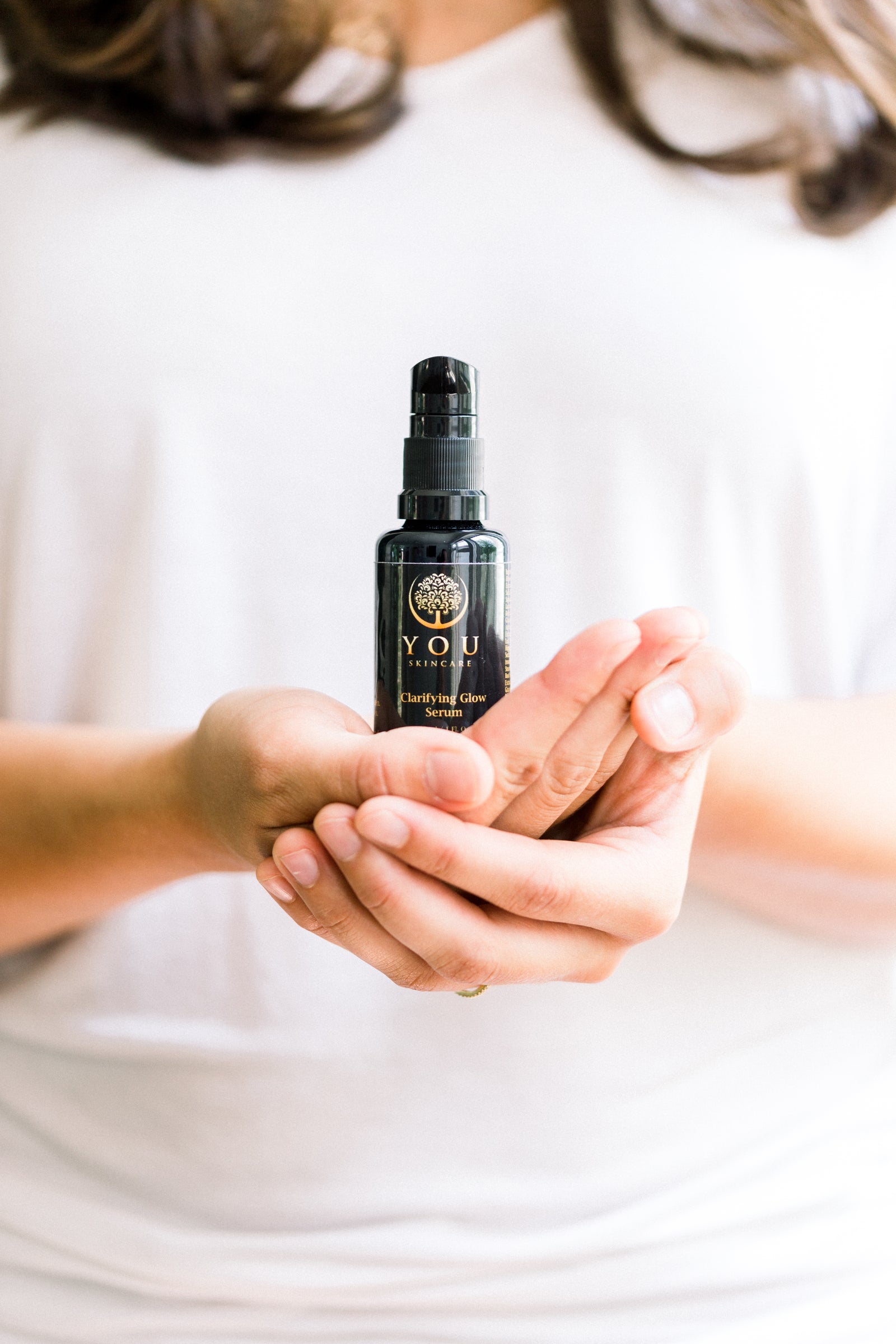 Woman applying science-led skincare formulated for sensitive, acne-prone skin