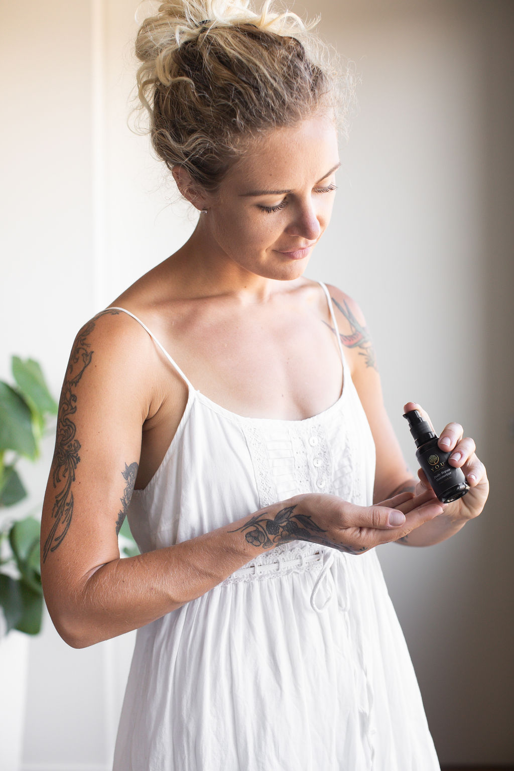 Woman applying science-led skincare formulated for sensitive, acne-prone skin